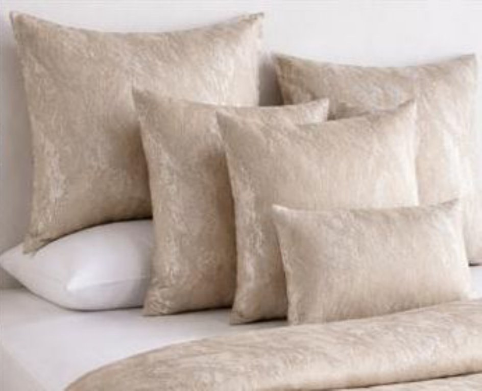 Si Home metallic jacquard cushions on a bed